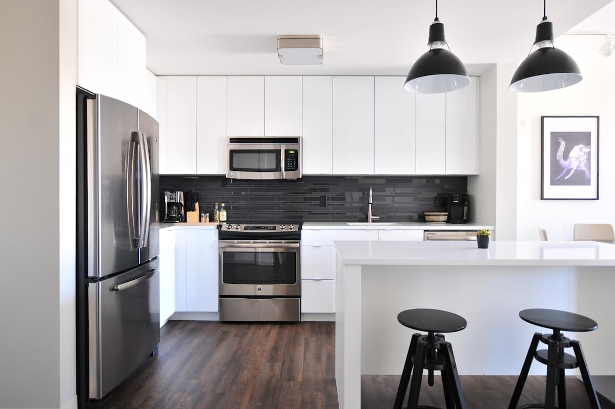 Bright white kitchen with a professionally cleaned oven